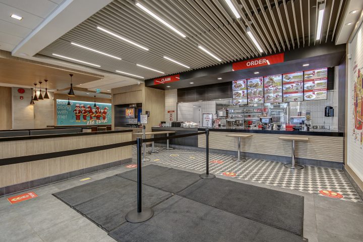 photo of Jollibee's inside seating & counter area - by BUILD IT
